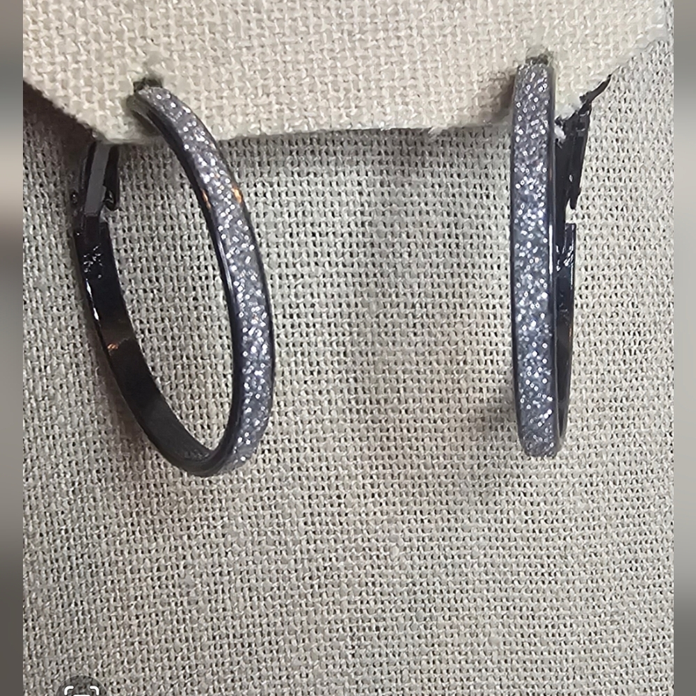 Black hoop earrings with sparkly rhinestones